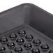 A close-up of a black HS Inc. Polypropylene Pizza Pleezer tray with round holes.