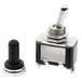 A close-up of a black and silver Noble Products toggle switch with a black knob.