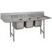 A stainless steel Advance Tabco three compartment pot sink with two drainboards.