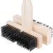 A Carlisle double head grill cleaning brush with black bristles in a wooden brush holder.