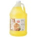 A jug of yellow Carnival King Pina Colada slushy syrup with a lid.