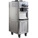 A Spaceman commercial ice cream machine with stainless steel hoppers and a stainless steel cabinet.