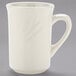 A Tuxton eggshell white china mug with an embossed rim and handle.
