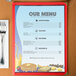 Menu paper with a coffee shop table setting design on a menu with a picture of food and drinks.