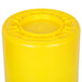 A yellow plastic Continental Huskee trash can with a circular lid.