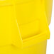 A yellow Continental round trash can with lid.