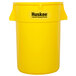 A yellow Continental Huskee trash can with black text and a lid.