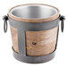 A 10 Strawberry Street Telluride natural wood wine bucket with metal handles on a table.