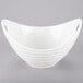 A white bowl with curved lines and handles.