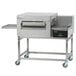 A Lincoln stainless steel ventless electric conveyor oven with a sliding door.