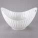 A white porcelain boat bowl with curved edges and a line texture.