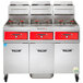 A Vulcan 3 unit floor fryer system with red digital controls.