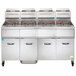 A large commercial deep fryer with four baskets.