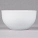 A white 10 Strawberry Street Wazee Matte stoneware bowl on a white surface.