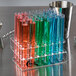 A group of Choice Crystal Clear Plastic test tubes with blue and green liquid in them.