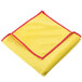 A yellow and red Unger SmartColor microfiber cloth with a red border.