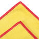 A yellow and red Unger SmartColor microfiber cleaning cloth.