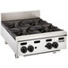 A stainless steel Vulcan countertop range with four burners.