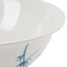 A close up of a Thunder Group Blue Bamboo melamine bowl with a blue and white bamboo design on a white background.