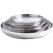A stack of three American Metalcraft stainless steel seafood trays with a hammered finish.