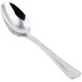 A close-up of a Libbey stainless steel demitasse spoon with a silver handle.