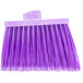 A close up of a Carlisle purple broom head with purple flagged bristles.