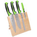 A Mercer Culinary Millennia Colors® knife set in a rubberwood stand with green handles.