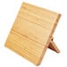 A Mercer Culinary bamboo knife rack with a wooden board.