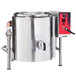 A large stainless steel Vulcan steam kettle with a red handle.