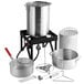 A silver Backyard Pro turkey fryer and seafood boiler pot with a black handle on a stand.