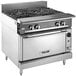 A Vulcan V Series 4 burner commercial gas range on a stainless steel countertop.