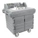 A grey plastic Cambro CamKiosk portable self-contained hand sink with two sinks.