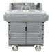 A grey Cambro plastic hand sink cart with wheels.