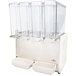 A white rectangular Crathco refrigerated beverage dispenser with four clear containers and a white vent with holes.