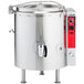 A large stainless steel Vulcan steam kettle with a red lid.