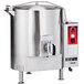 A large stainless steel Vulcan stationary steam jacketed kettle with a red handle.