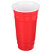 A red plastic GET tumbler with a white rim.