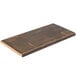 An American Metalcraft carbonized bamboo serving board on a table.