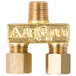 A gold brass pilot valve for a Cooking Performance Group stove burner with a nut on it.