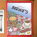 The Diner theme menu cover for Bernie's Restaurant with a picture of a burger and a cup of coffee on the table.