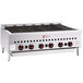 A Wolf natural gas low profile radiant gas charbroiler with red knobs on a counter.