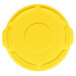 A yellow plastic lid with a circular hole.