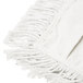 A white fringed cloth with rectangular fringes.