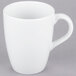 A white 10 Strawberry Street porcelain mug with a handle.