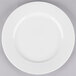 A white 10 Strawberry Street porcelain lunch plate with a white rim on a white surface.