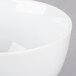 A close up of a white 10 Strawberry Street porcelain rice bowl with a white rim.
