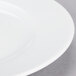 A close-up of a 10 Strawberry Street Classic White porcelain salad/dessert plate with a white rim.