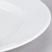 A close-up of a 10 Strawberry Street Classic White porcelain salad/dessert plate with a white rim.
