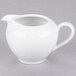 A 10 Strawberry Street white porcelain creamer with a handle.