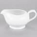 A white 10 Strawberry Street porcelain gravy boat with a handle.